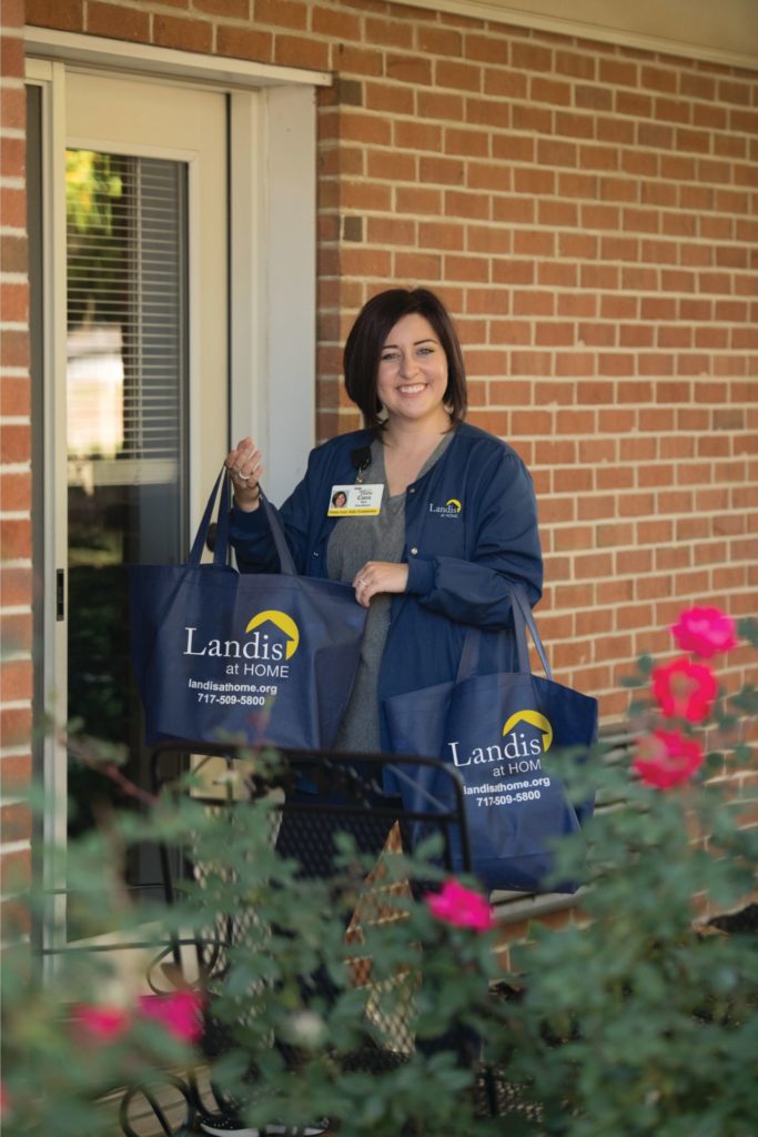 Employee holding bags